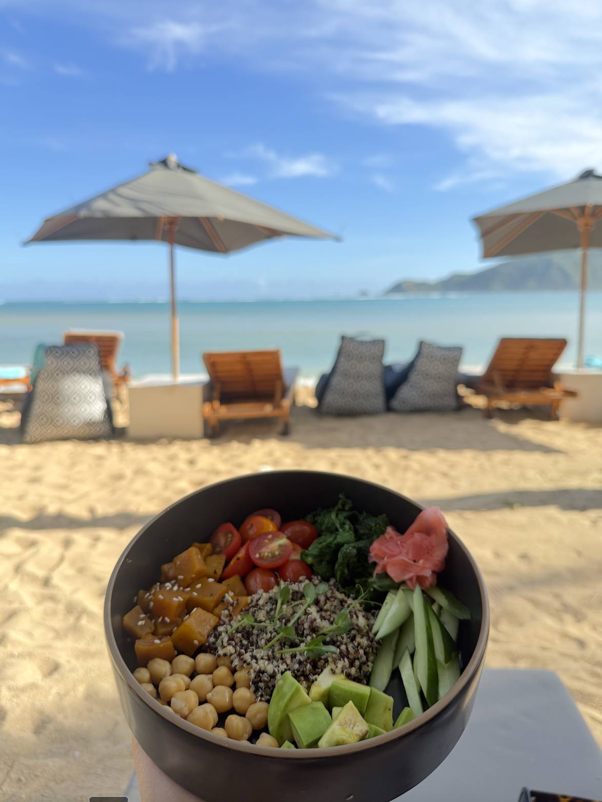 A bowl of food on the beach
