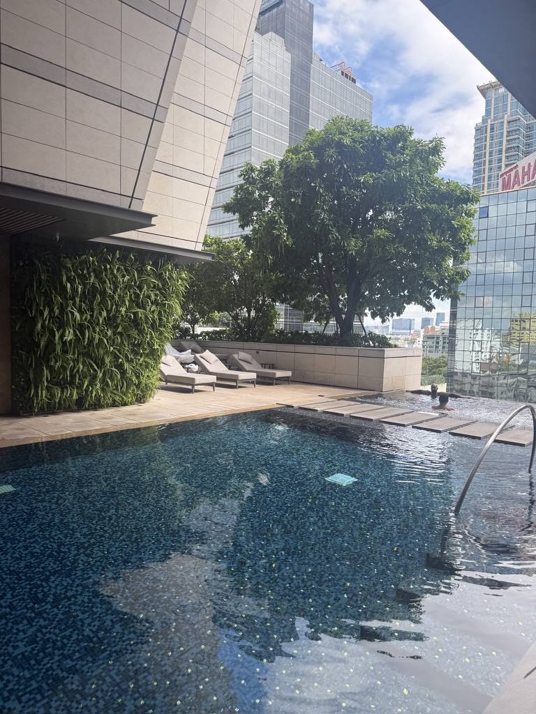 Rooftop pool above Bangkok at dusk