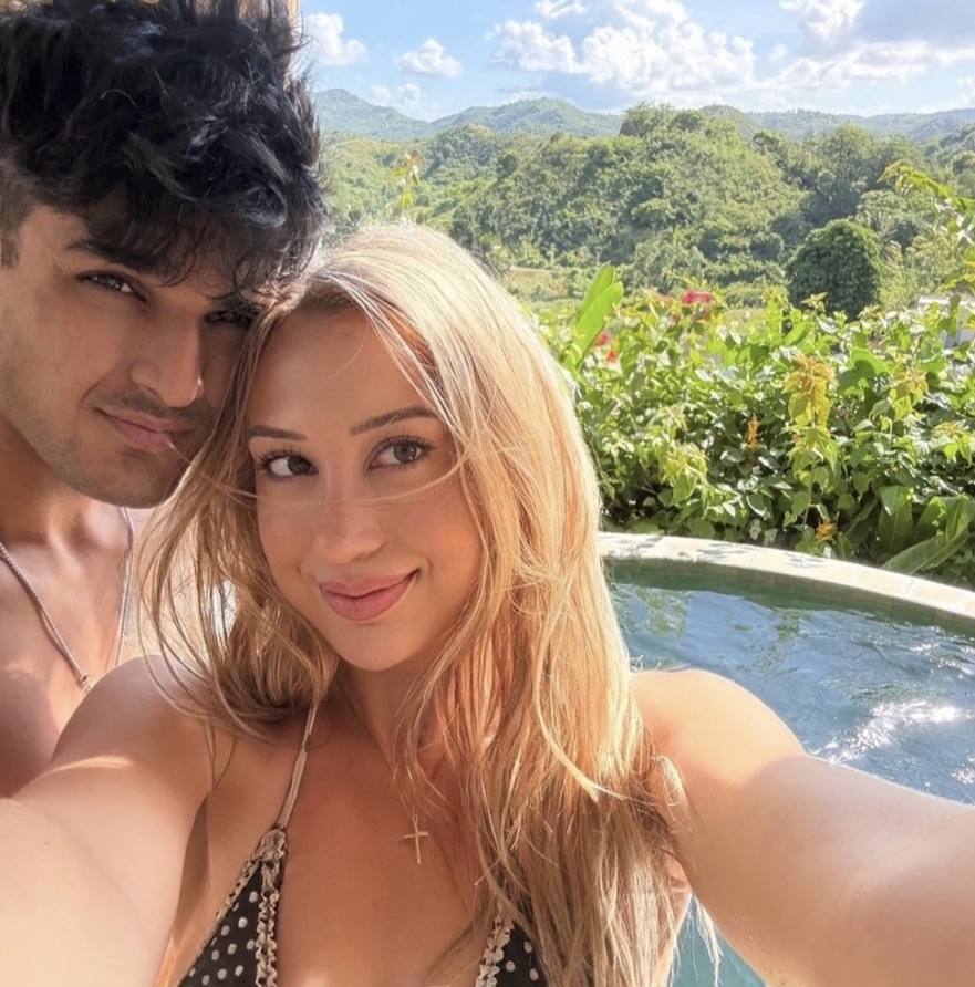 Two people in a quiet hotel pool