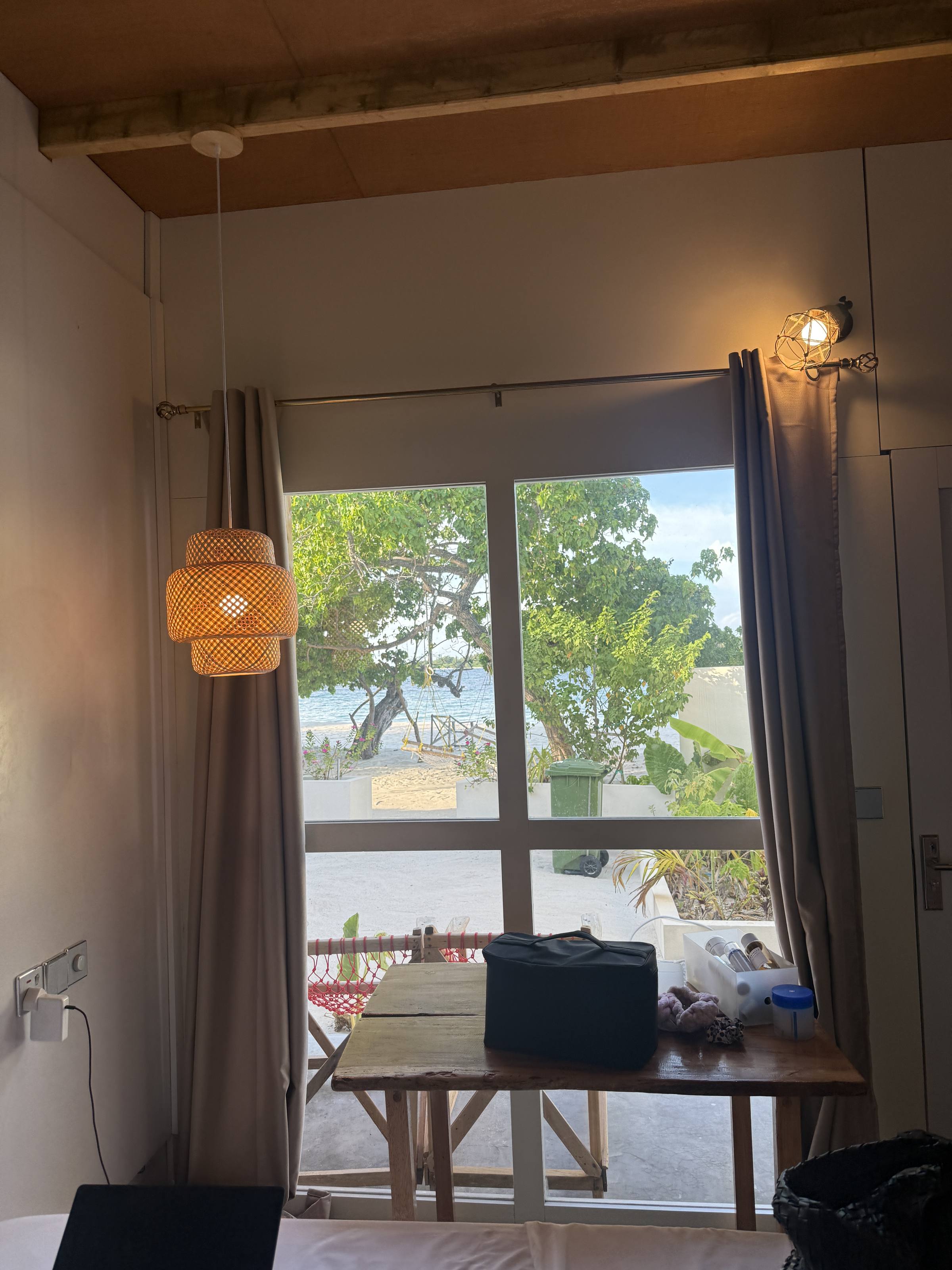 A simple guesthouse room with the sea outside