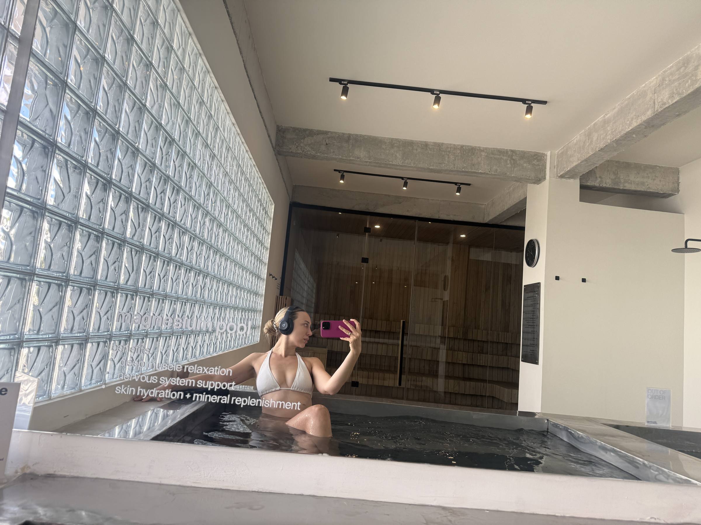 In the thermal pool with headphones on