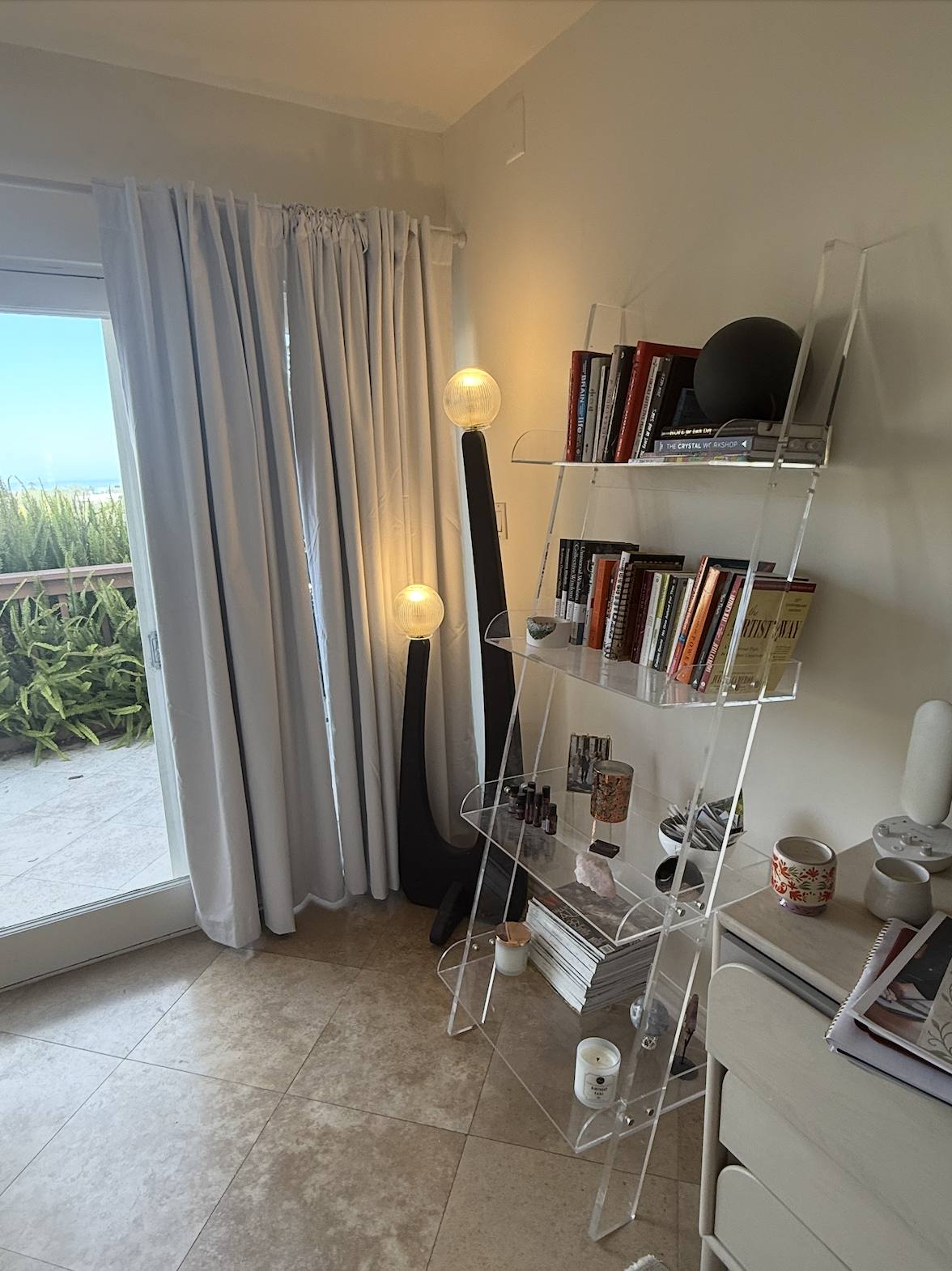 The bookcase, books and objects arranged