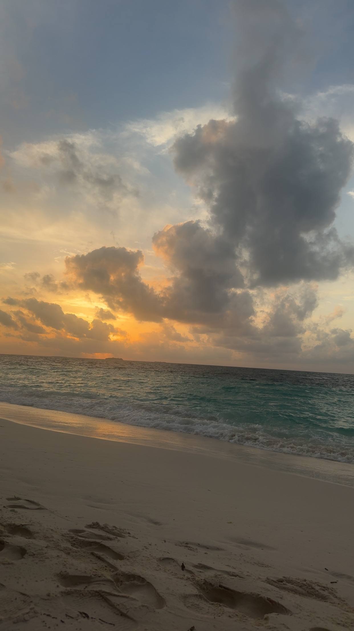 Gold light breaking through cloud over the sea